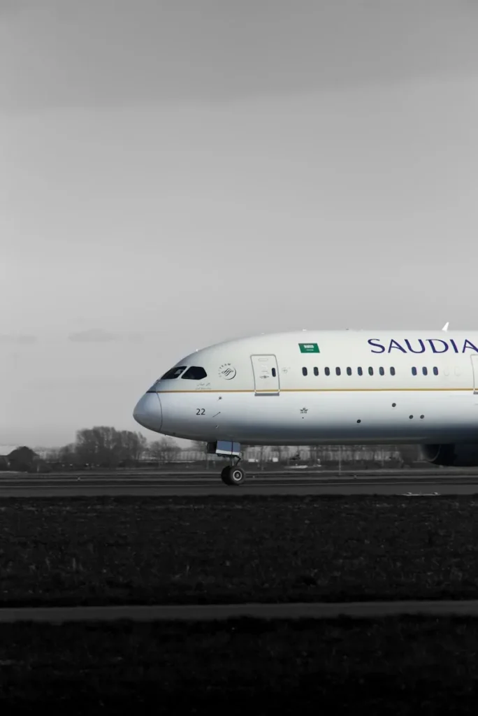 A large passenger jet sitting on top of an airport runway